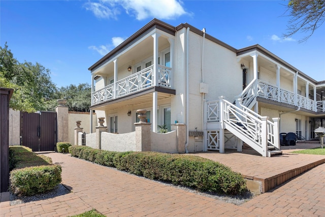 view of side of property featuring a balcony