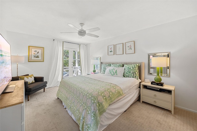 carpeted bedroom with ceiling fan, access to outside, and french doors