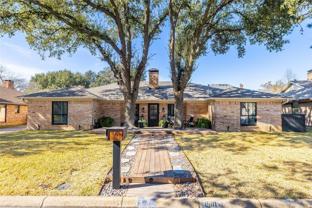 single story home featuring a front yard