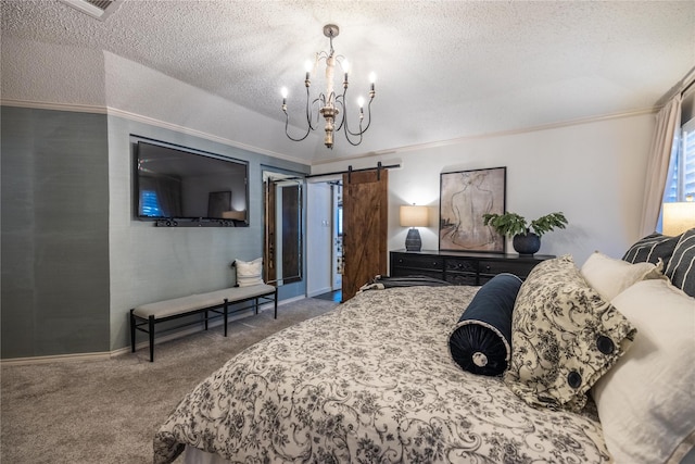 carpeted bedroom with a notable chandelier, crown molding, a barn door, and a textured ceiling