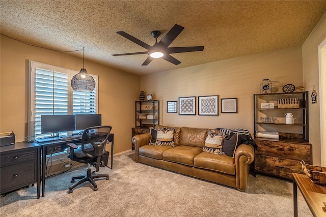 carpeted office with ceiling fan and a textured ceiling