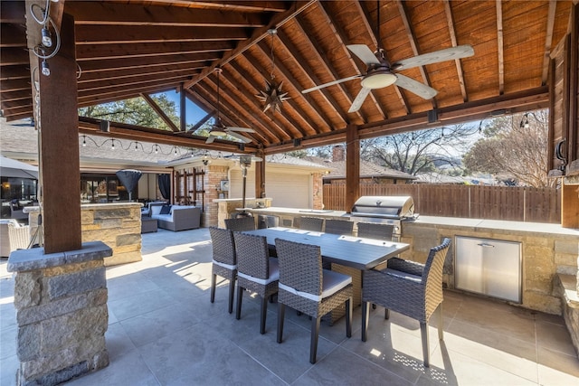 view of patio featuring area for grilling, a gazebo, and ceiling fan