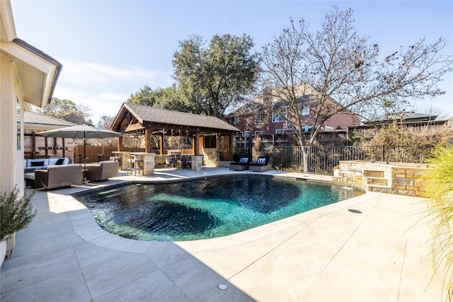 view of pool featuring a gazebo, outdoor lounge area, a patio area, and exterior bar