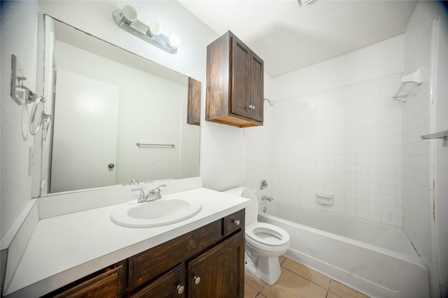 full bathroom featuring toilet, a textured ceiling, tile patterned flooring, vanity, and tiled shower / bath