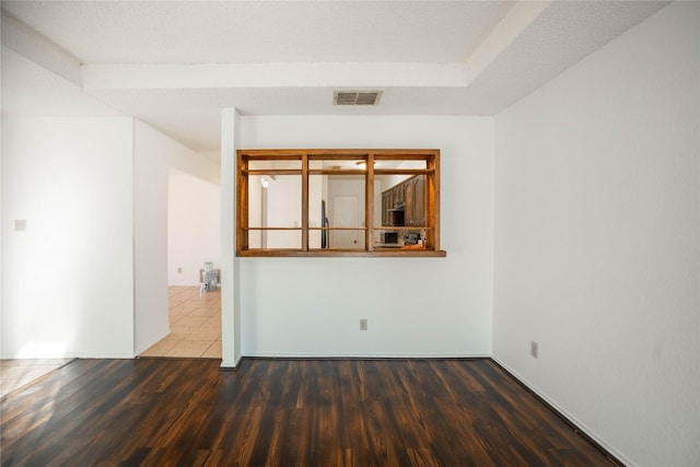 unfurnished room featuring dark hardwood / wood-style floors