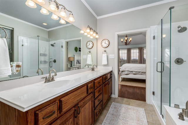 bathroom featuring an enclosed shower, vanity, crown molding, and tile patterned flooring