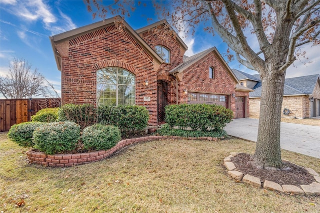 view of front of property featuring a garage and a front yard