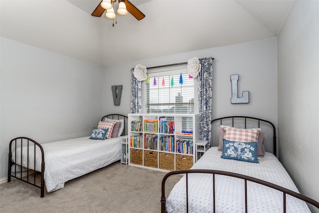 carpeted bedroom with ceiling fan and lofted ceiling