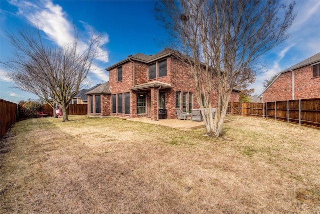 rear view of property with central air condition unit, a patio, and a yard