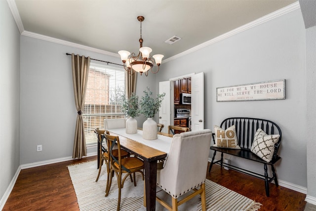 dining area with dark hardwood / wood-style flooring, ornamental molding, and a chandelier