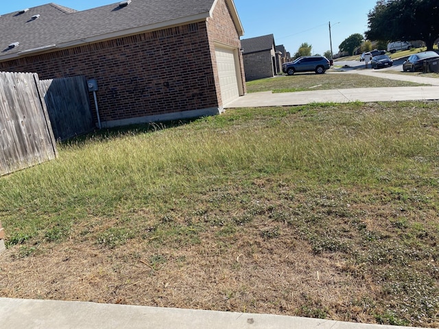 view of yard with a garage