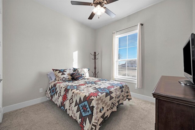 bedroom with light carpet and ceiling fan