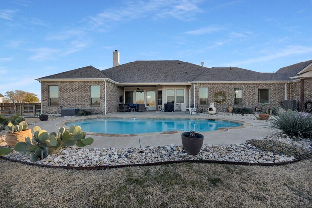 view of pool with a patio and ceiling fan