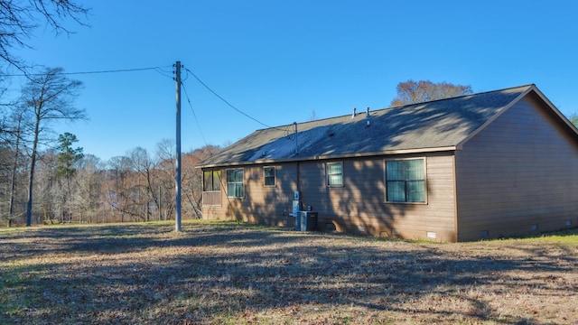 back of house featuring cooling unit