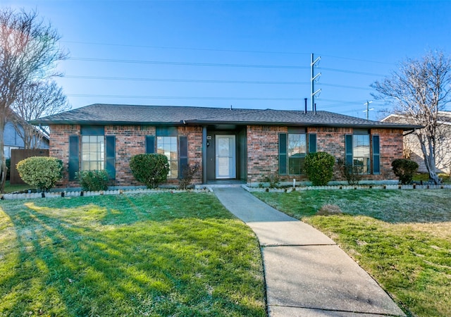 ranch-style house with a front lawn