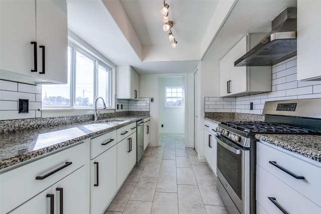 kitchen with white cabinetry, wall chimney range hood, and stainless steel appliances