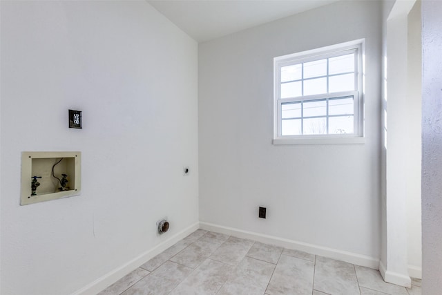 clothes washing area with hookup for an electric dryer, washer hookup, and light tile patterned floors