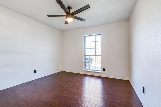 empty room featuring ceiling fan and dark hardwood / wood-style flooring