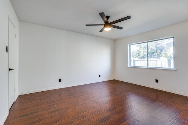 unfurnished room with ceiling fan and dark hardwood / wood-style floors