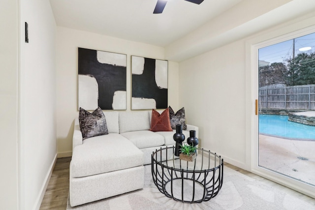 living room with ceiling fan and wood-type flooring