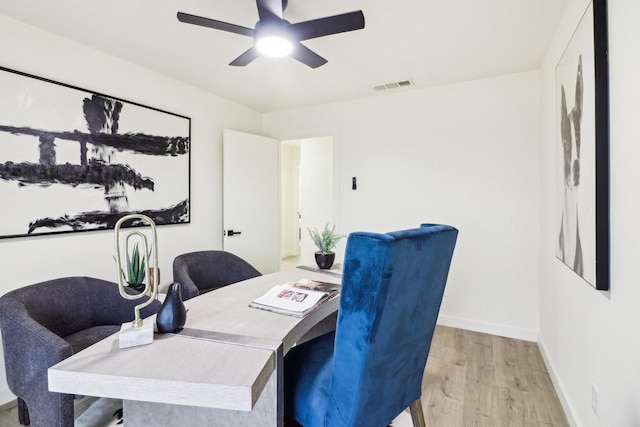 office area with ceiling fan and light hardwood / wood-style floors