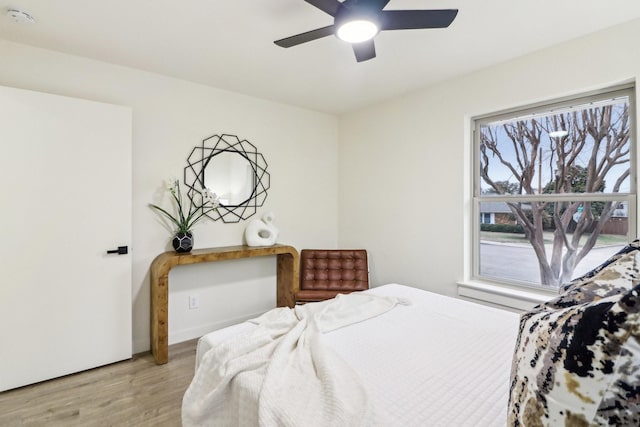 bedroom featuring ceiling fan and light wood-type flooring