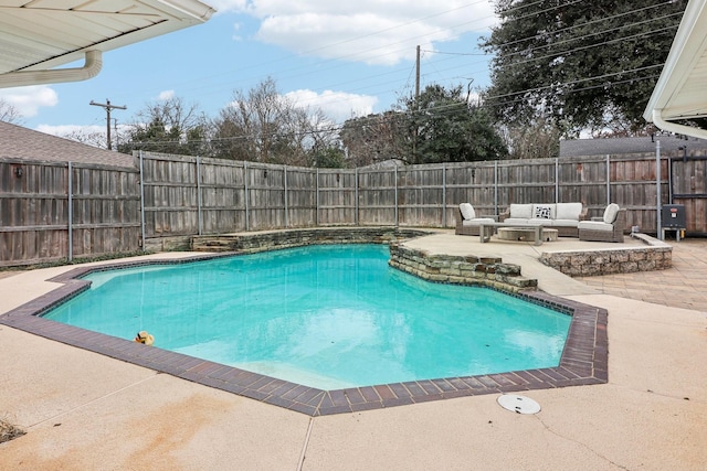 view of pool featuring an outdoor living space and a patio area