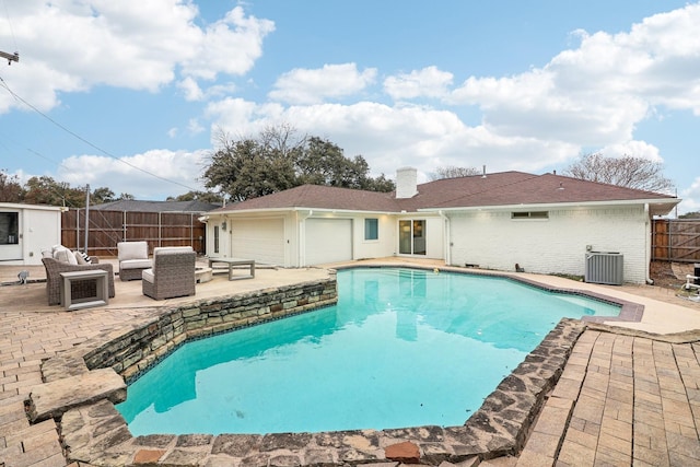 view of swimming pool with cooling unit, an outdoor living space, and a patio