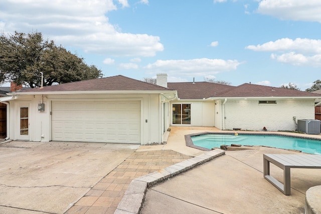 view of pool featuring central AC unit