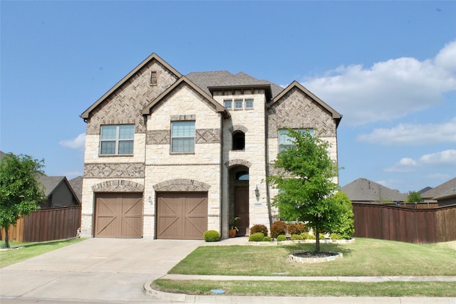 1625 Veneto Dr, Mclendon Chisholm, TX 75032 - view of front of home with fence, concrete driveway, a front lawn, and stone siding