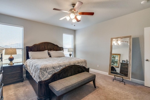 bedroom with light carpet and ceiling fan