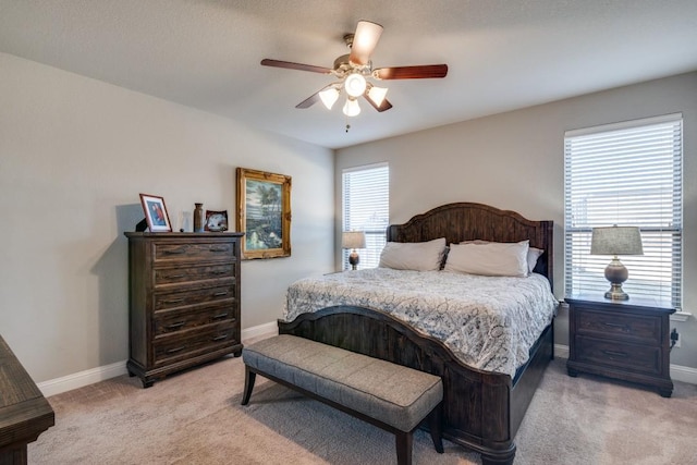 bedroom featuring ceiling fan and light colored carpet