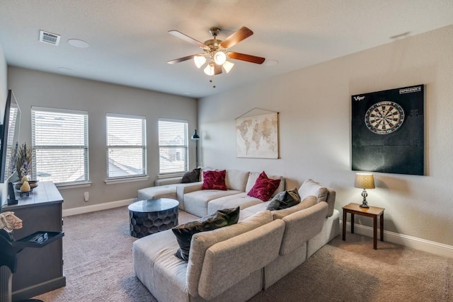 living room with ceiling fan and carpet flooring