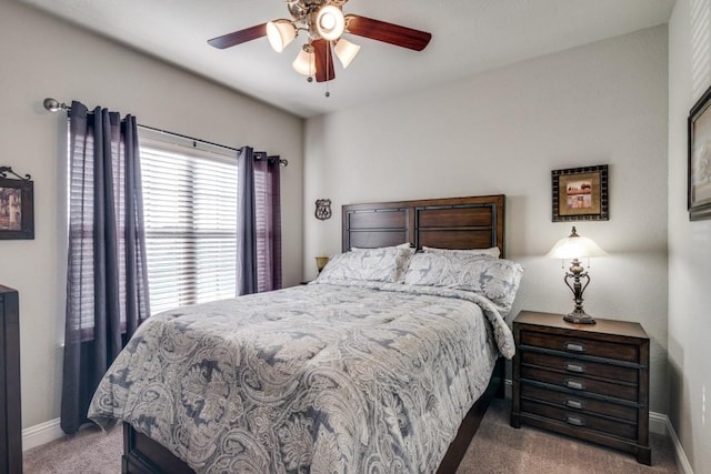 bedroom featuring ceiling fan and dark colored carpet