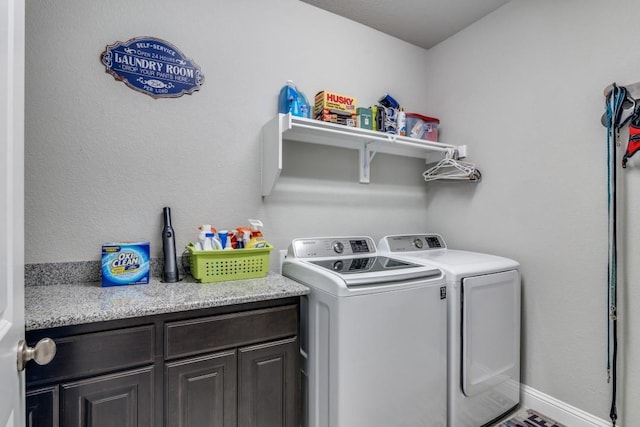 laundry area with cabinets and washing machine and dryer