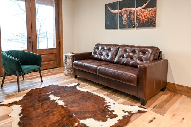 living room with hardwood / wood-style floors and french doors