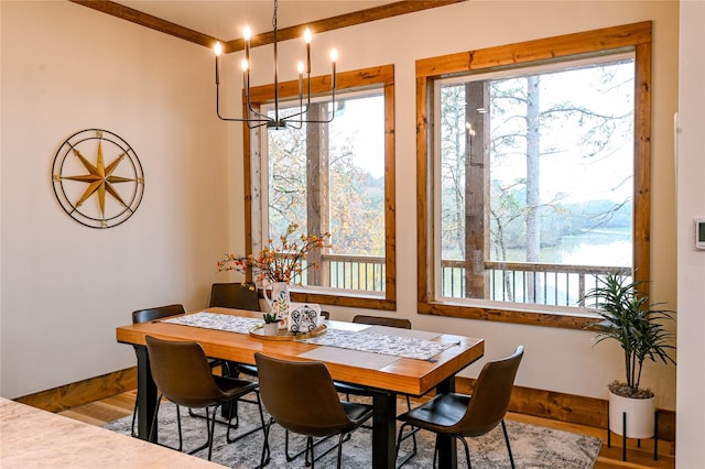 dining area featuring hardwood / wood-style flooring and a chandelier