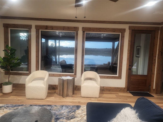 interior space with crown molding and hardwood / wood-style floors