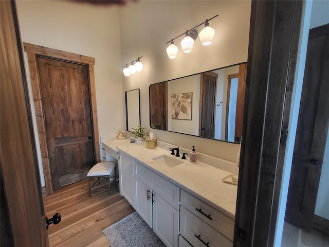 bathroom with vanity and hardwood / wood-style flooring