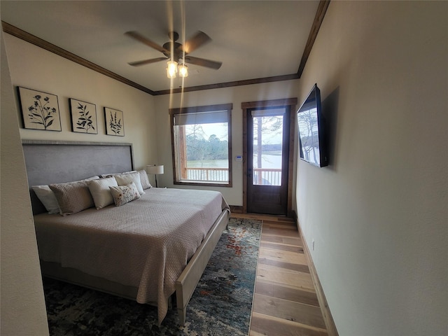 bedroom with crown molding, hardwood / wood-style flooring, access to exterior, and ceiling fan