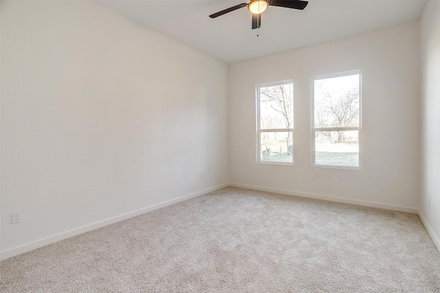 unfurnished room with carpet floors and ceiling fan