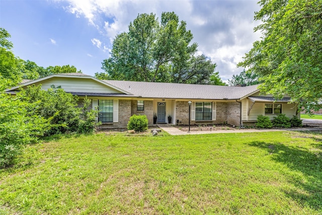 ranch-style house with a front yard