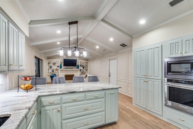 kitchen with appliances with stainless steel finishes, built in shelves, light hardwood / wood-style flooring, vaulted ceiling with beams, and light stone counters