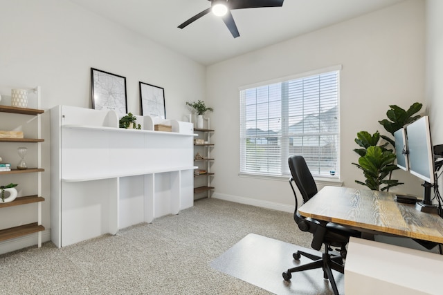 carpeted office with ceiling fan