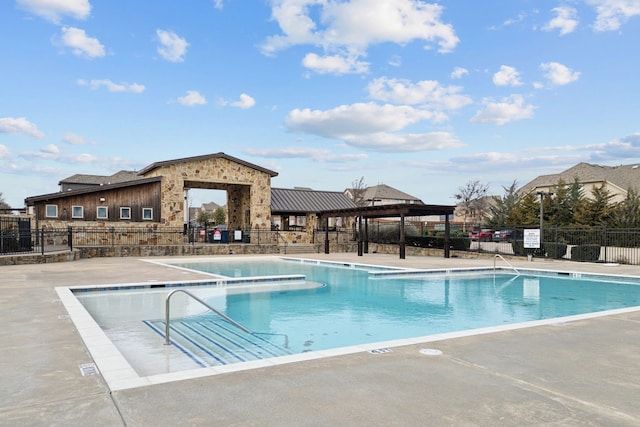 view of swimming pool with a patio area