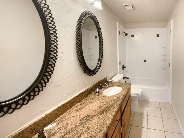 full bathroom featuring tub / shower combination, tile patterned floors, toilet, a textured ceiling, and vanity