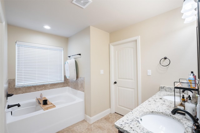 bathroom featuring vanity and a bathtub