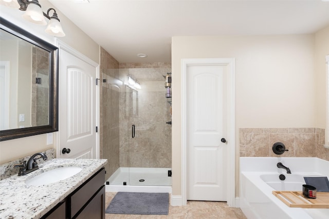 bathroom with vanity, tile patterned floors, and separate shower and tub