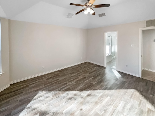 empty room with ceiling fan and dark hardwood / wood-style floors