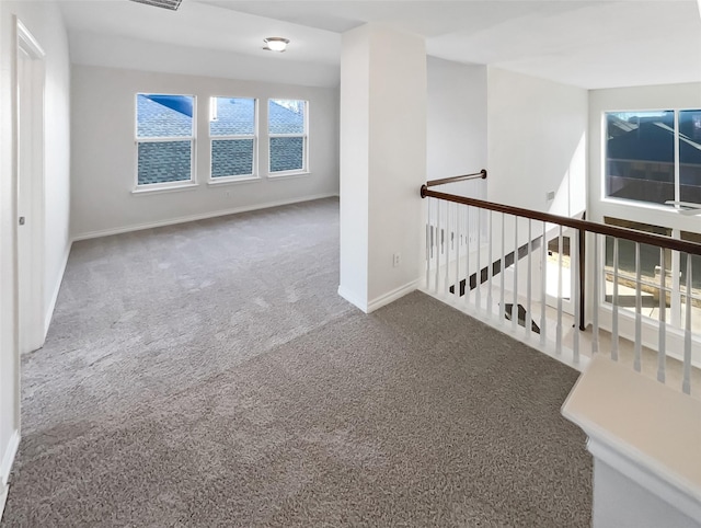 unfurnished room with carpet flooring